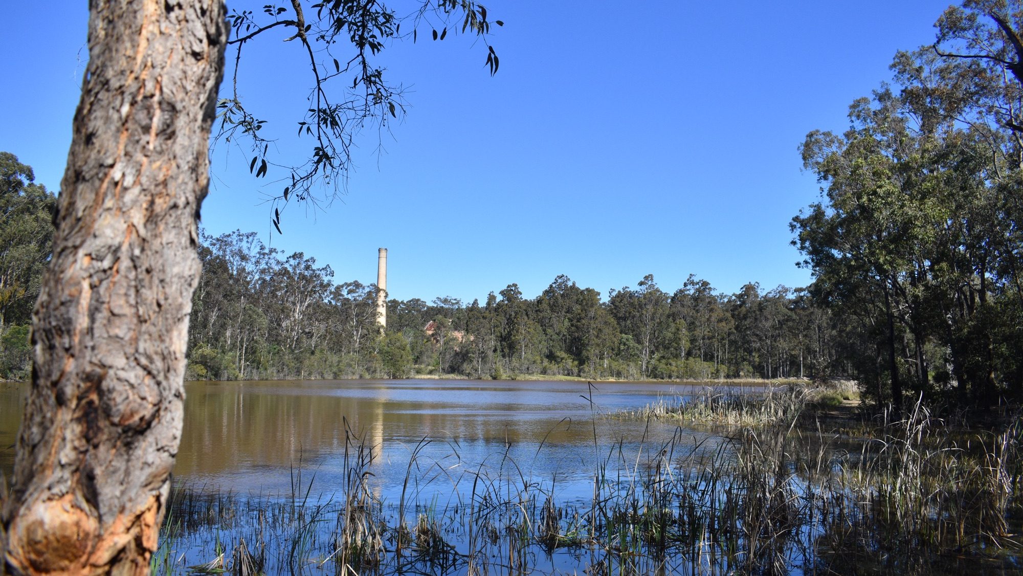 large chimney visible across lake