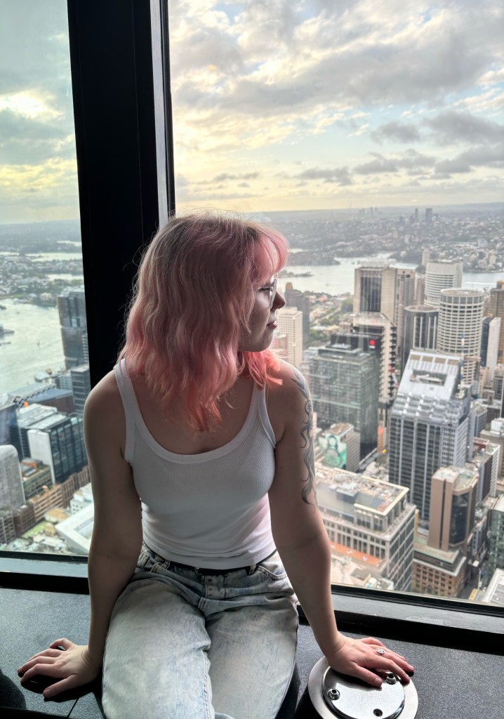 person sitting against window