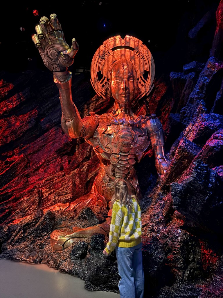 person admiring robot animatronic