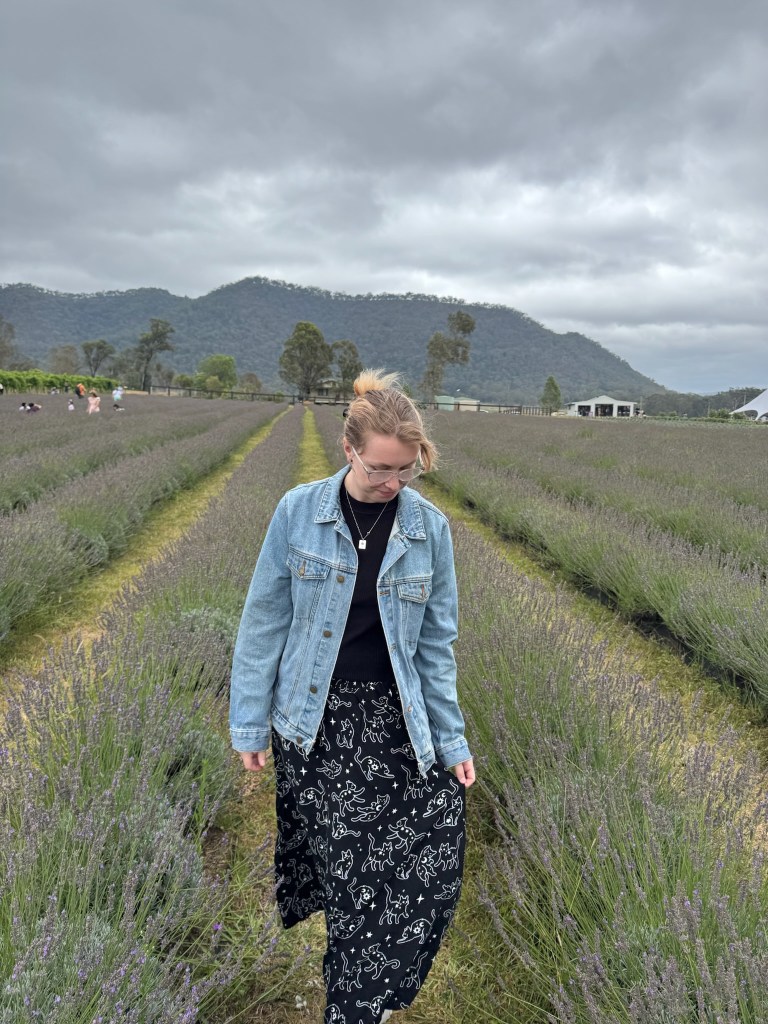 person walking through lavender fields