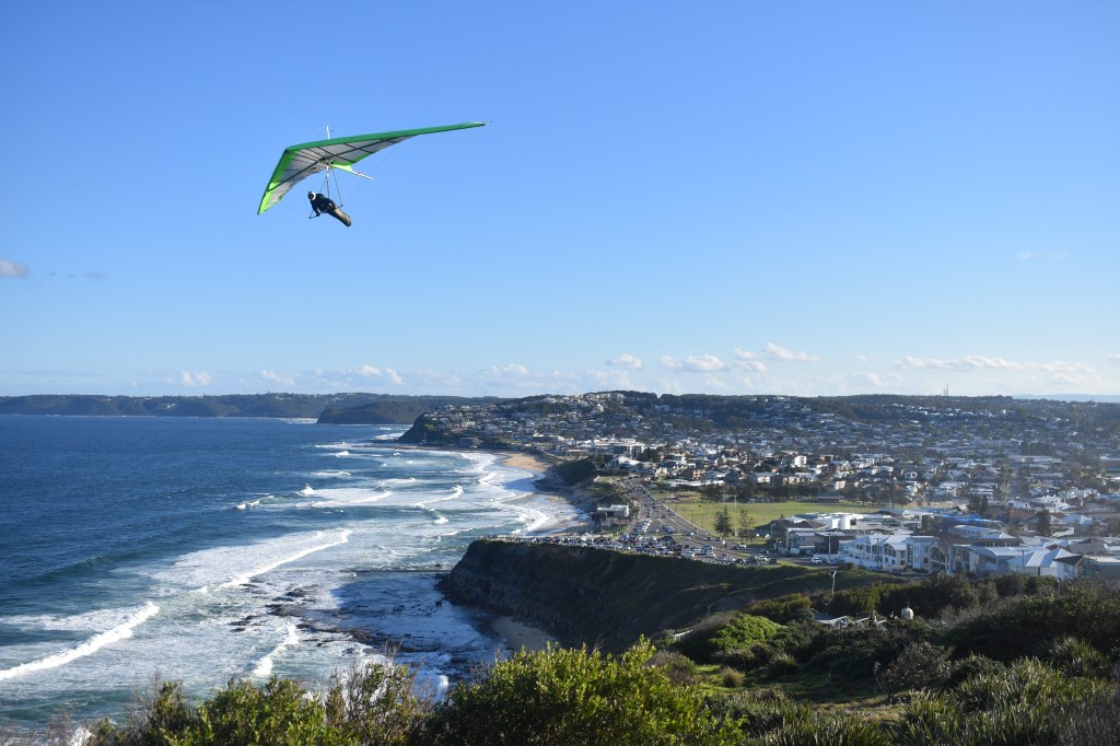 hang glider over Newcastle city and beach