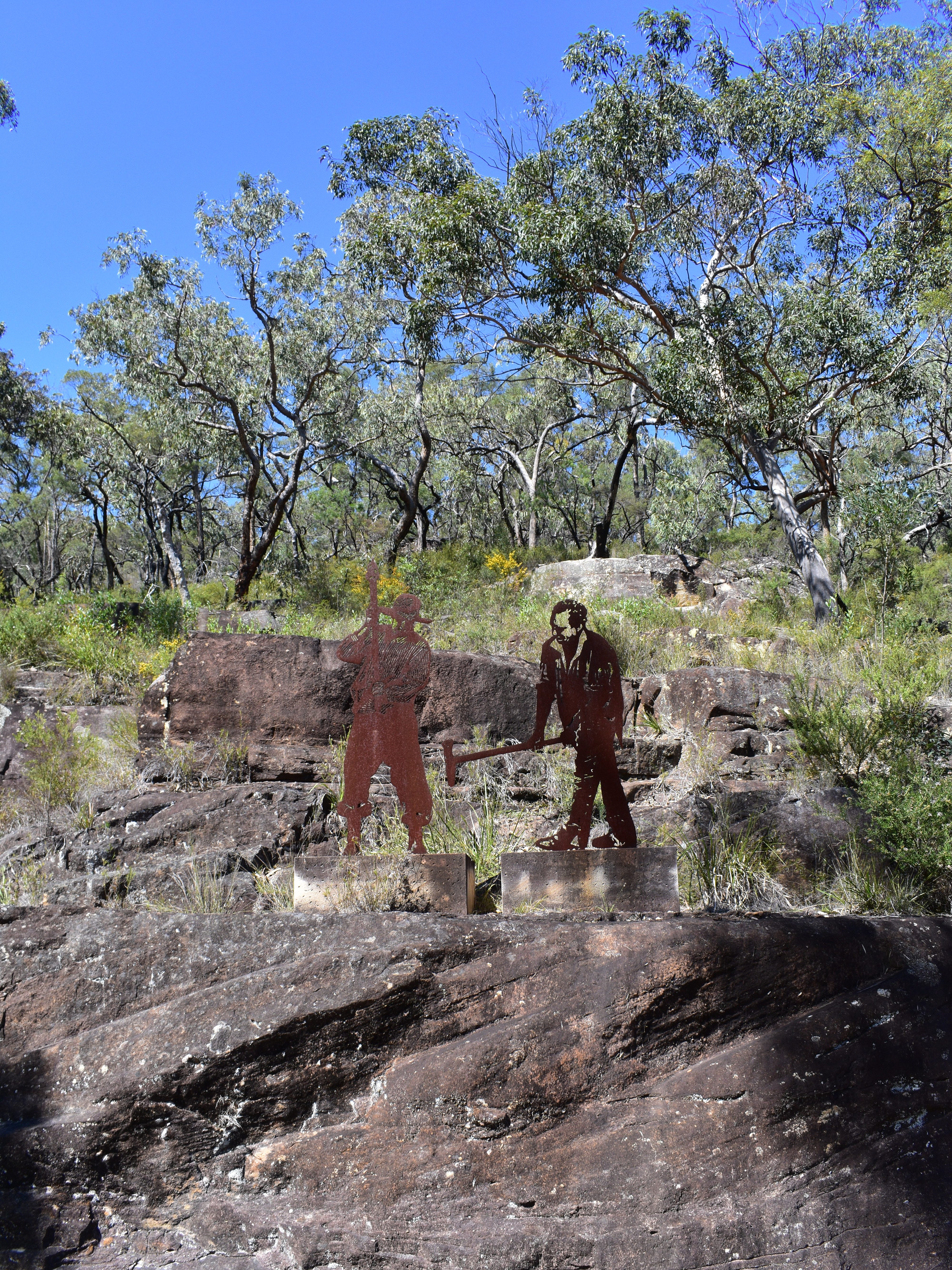 metal statues of Australian convicts cutting rock
